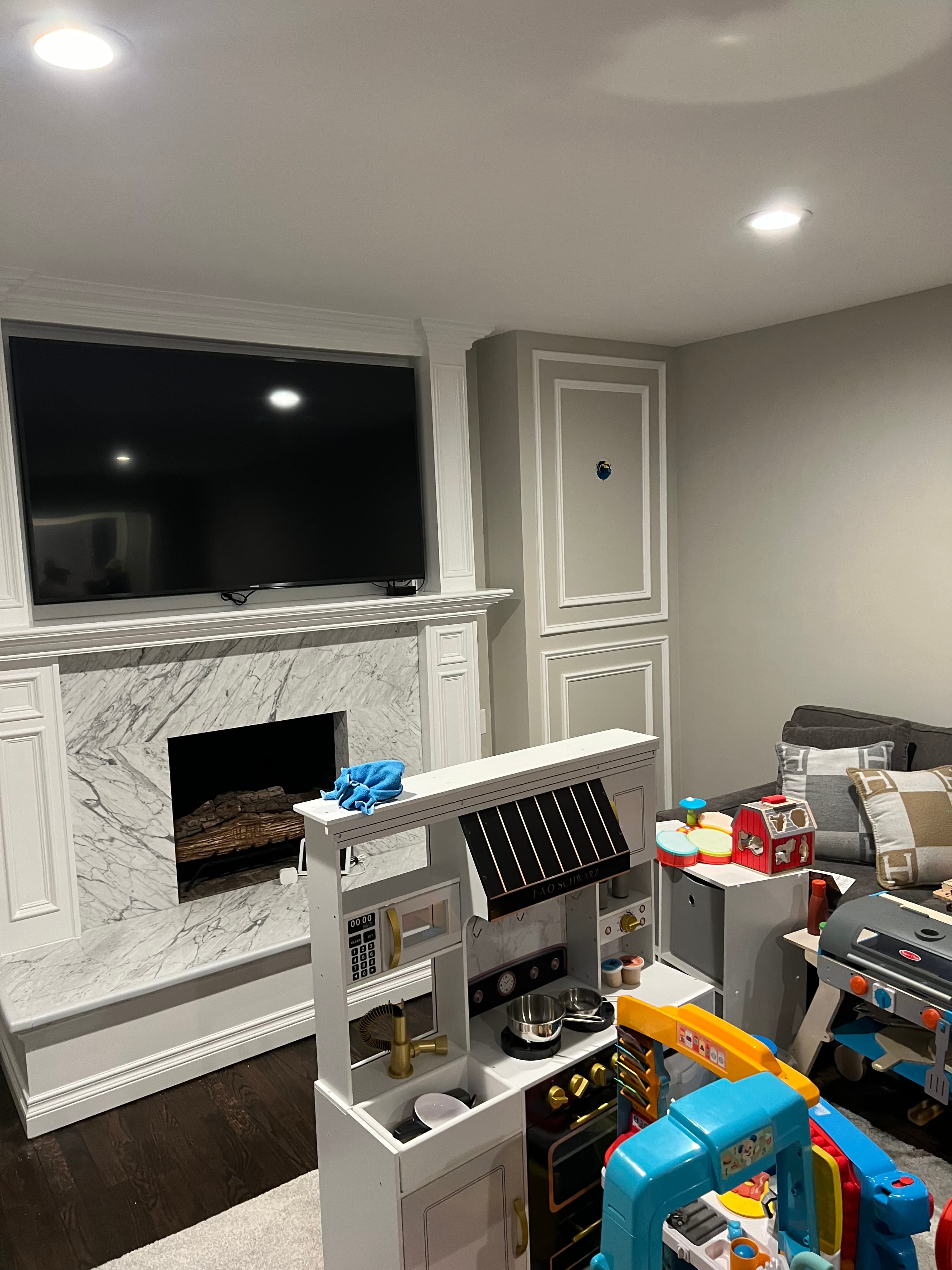 Modern kitchen with white cabinets and marble island