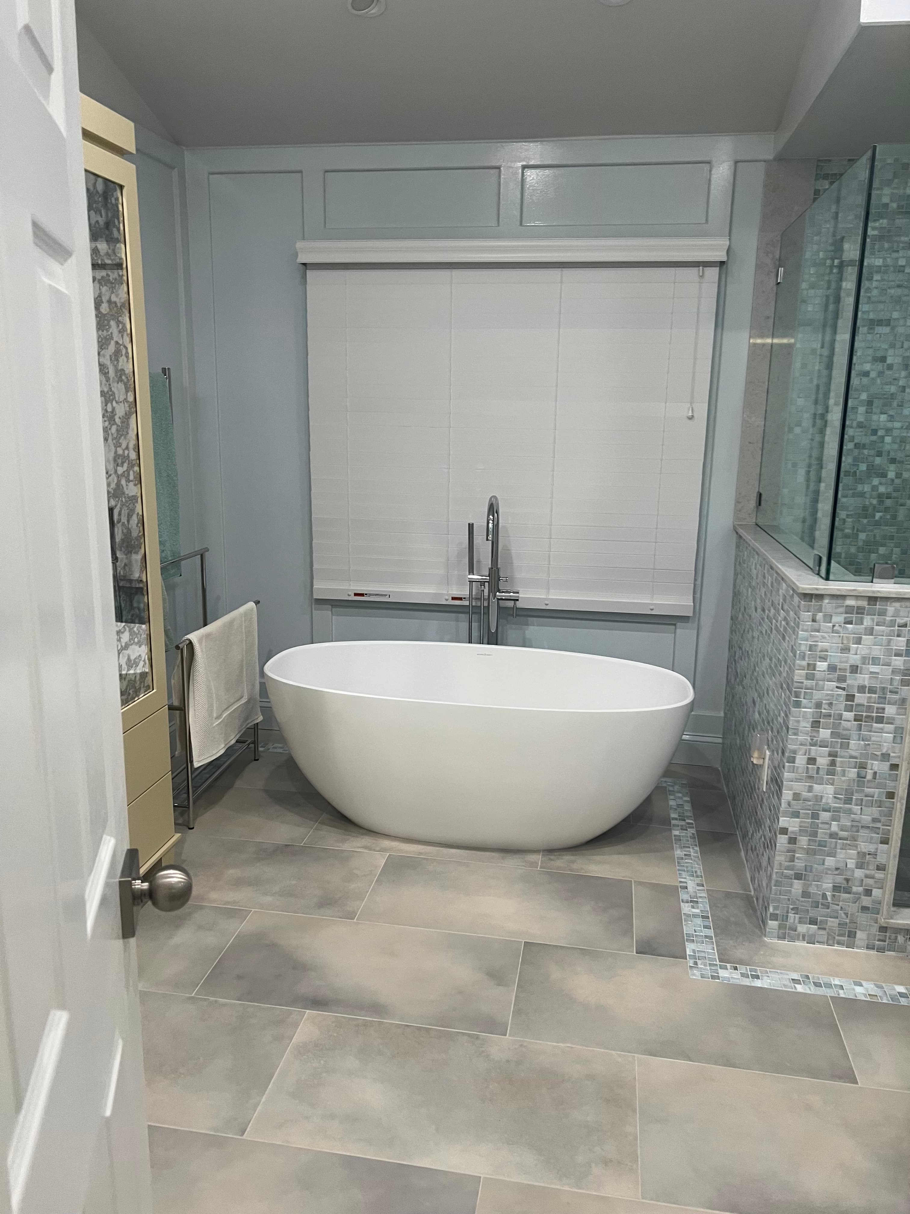 Spa-like bathroom with custom vanity and storage