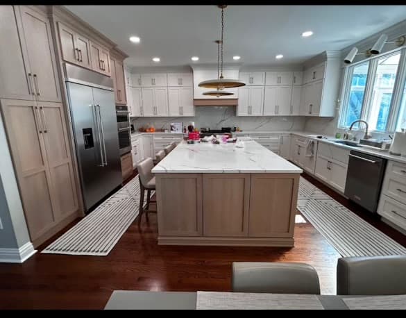 Elegant white kitchen with island and pendant lighting