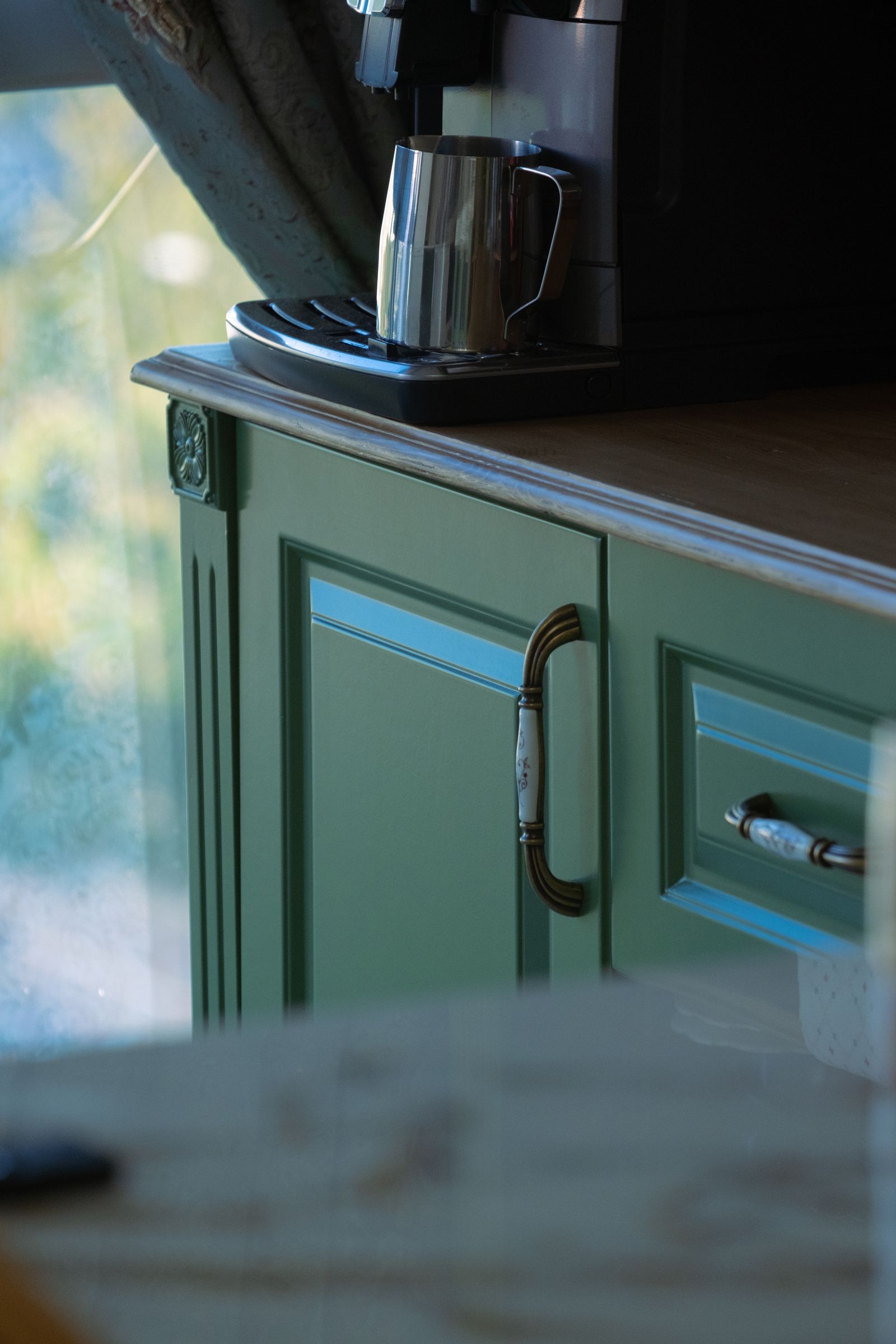 A built-in coffee nook with cabinetry, counter, and a finished back wall — the construction details are what separate a built-in from a tray on the counter
