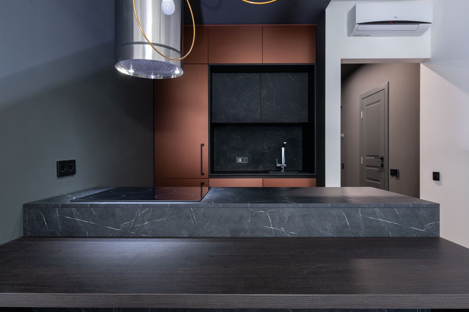 A bright kitchen with a white marble-look counter — porcelain slabs reproduce this marble look without marble's fragility