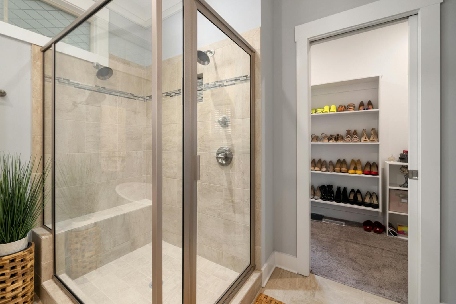 A tiled walk-in shower — a recessed niche is built into a wall like this during the tile installation