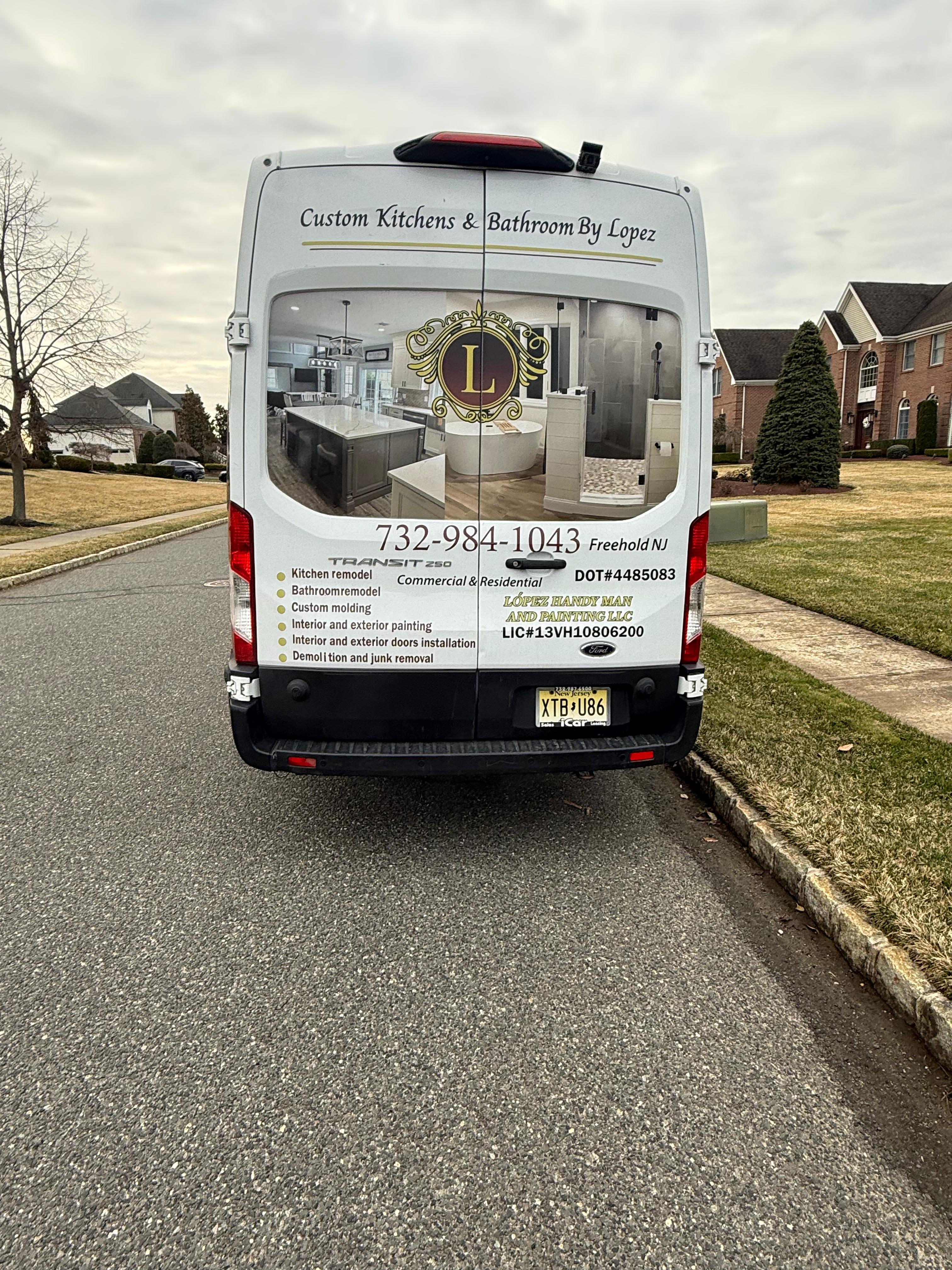 Custom Kitchens By Lopez branded van — rear view showing company branding and contact details